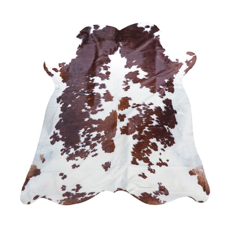 Brown and white cowhide rug with natural mottled spots, displayed flat against a solid white background.