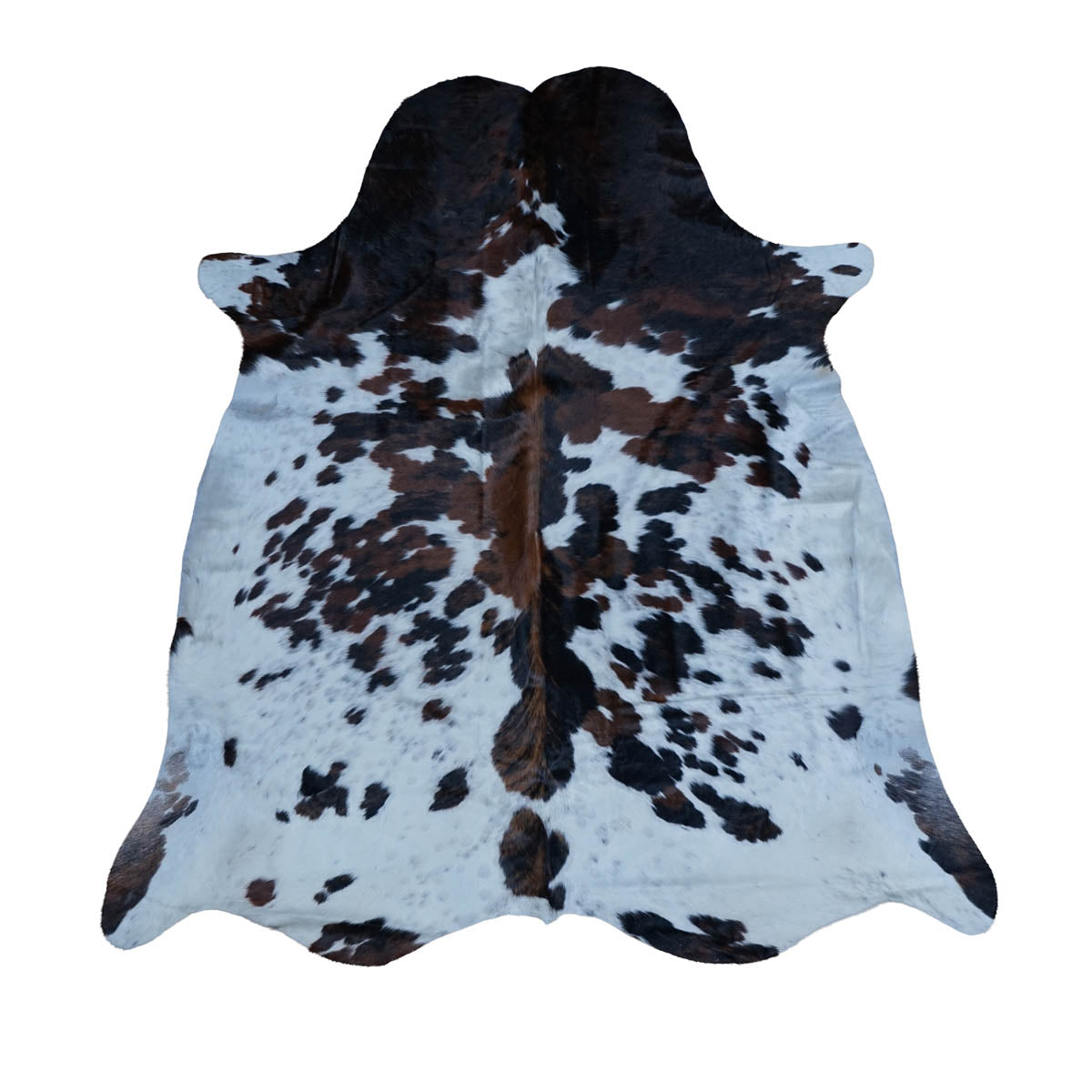 A natural cowhide rug with a black and brown spotted pattern on a white base, displayed flat against a solid white background.
