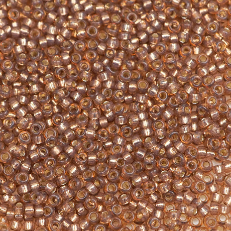 193-15641.SLC.1.jpg 15/0 Seed Beads - Rose Bronze S/L Alabaster 10g Image