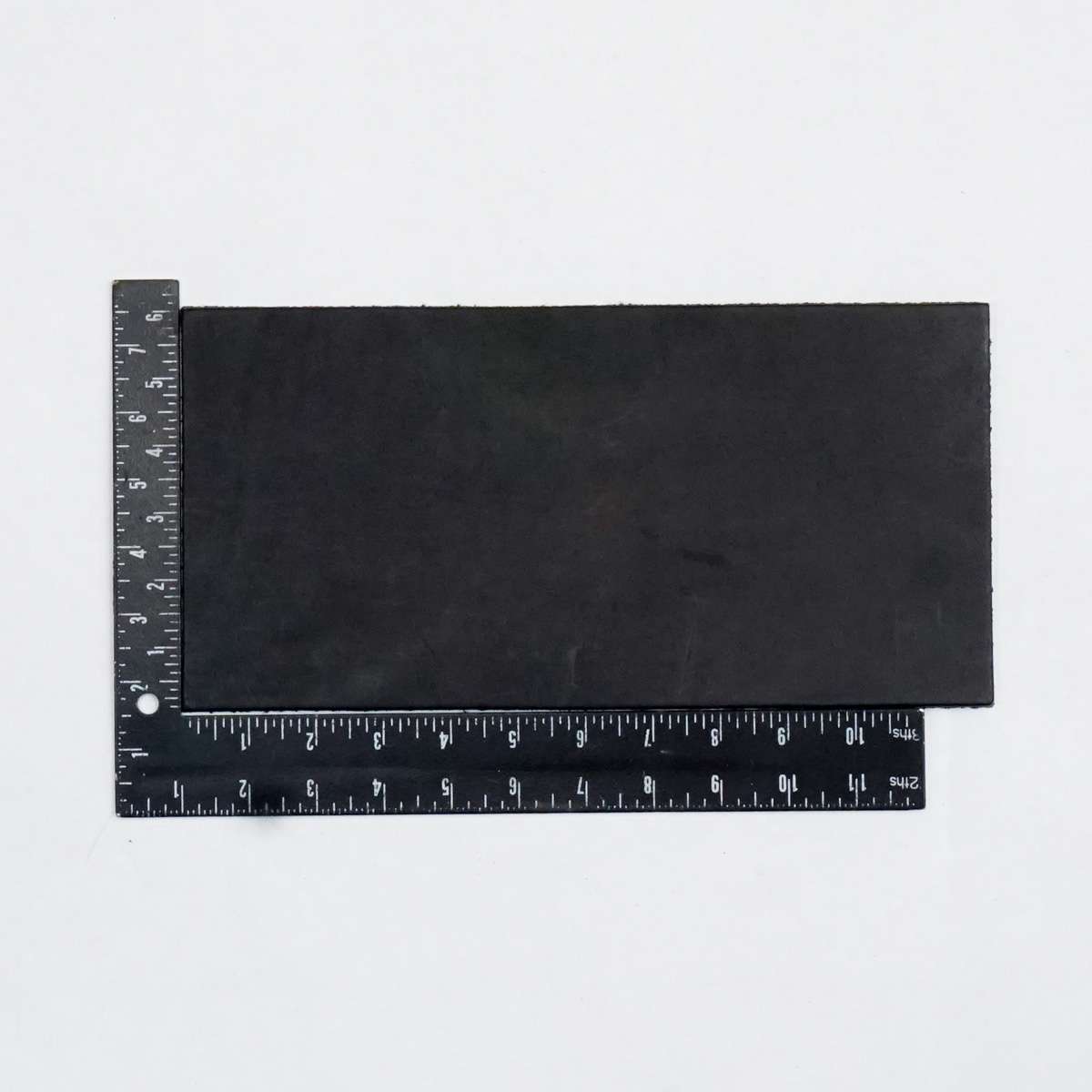 49-9100.SLC.2.jpg Hermann Oak Drum Dyed Black Pre-Cut 6-7 oz. 6" x 12" Image