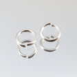 144-1008.SLC.jpg 25pk 6mm Silver Jump Rings Image
