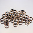 339-137.SLC.jpg 6mm Split Rings - Antique Copper 20pk Image