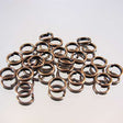 339-137.SLC.jpg 6mm Split Rings - Antique Copper 20pk Image