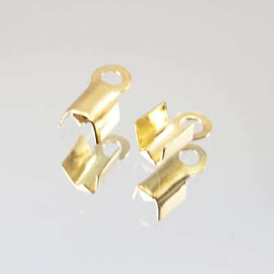 45-173501.SLC.jpg 12pk Fold Over Cord Ends - Gold Plate Image