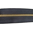 129-135301.SLC.jpg YKK #5 Zipper Tape - Black/Brass Yard Image