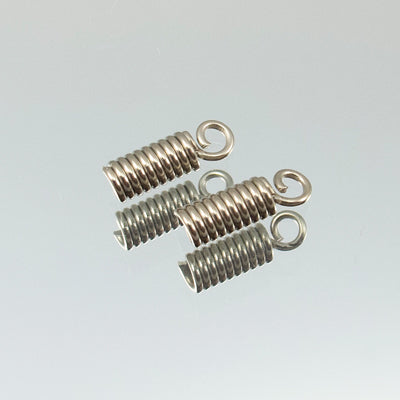 45-1001.SLC.jpg 1.5mm Spring Cord Ends - Nickel Plate 6pk Image