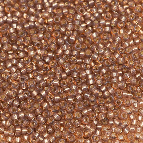 193-15641.SLC.1.jpg 15/0 Seed Beads - Rose Bronze S/L Alabaster 10g Image